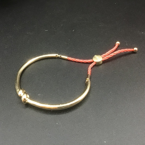 Guess “Love Knot” Bangle Bracelet in gold metal and Orange twisted Rope - Picture 1 of 7